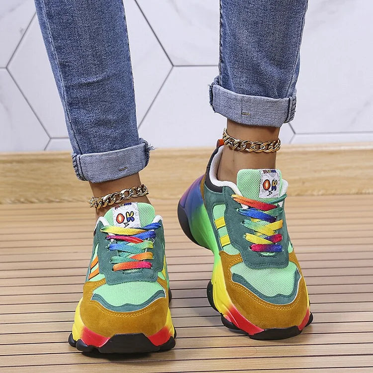 Multicolor lace-up chunky sneakers with green upper panels and multicolor rainbow soles