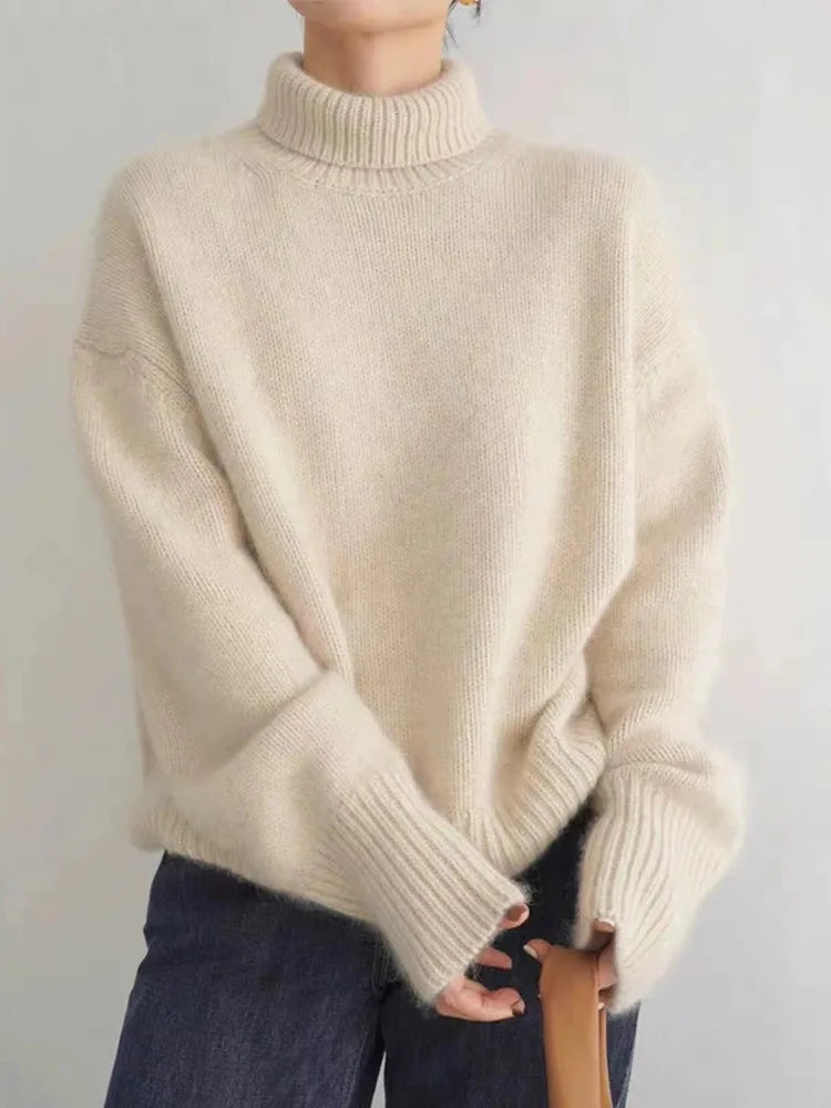 Beige turtleneck knit sweater with ribbed collar and cuffs