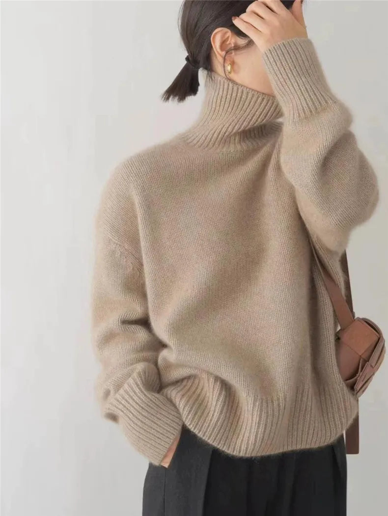 Beige turtleneck knit sweater with high ribbed collar and cuffs