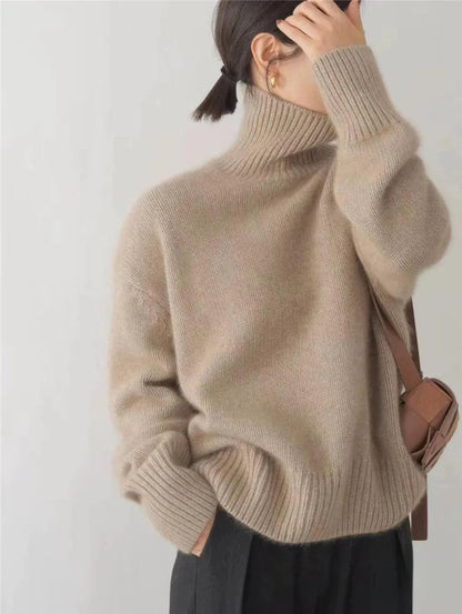Beige turtleneck knit sweater with high ribbed collar and cuffs