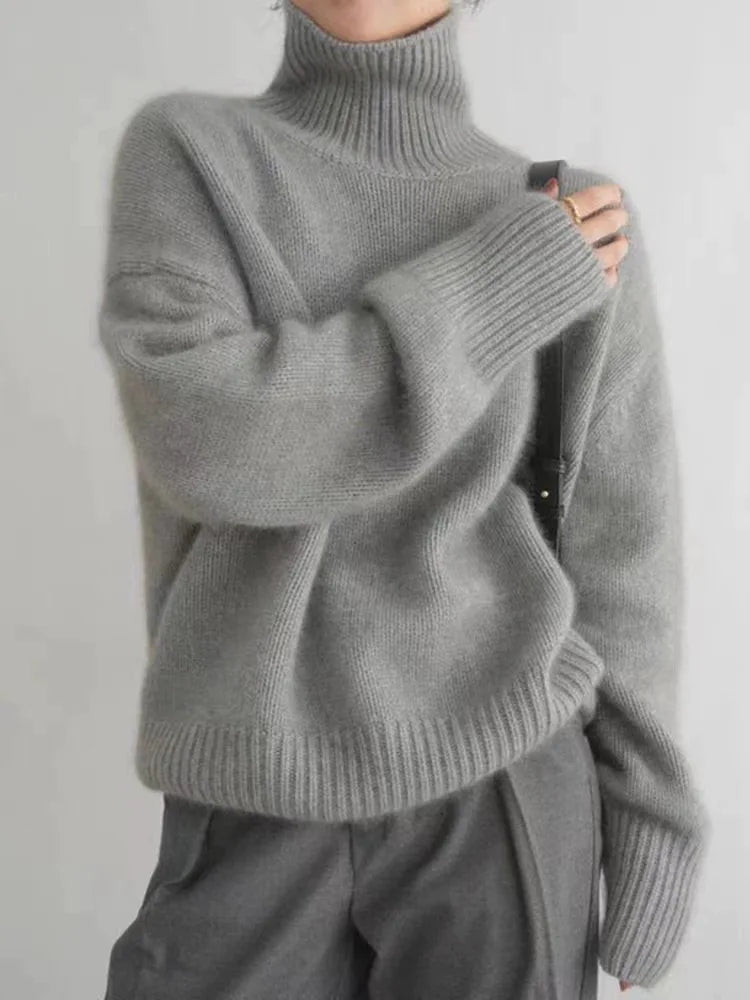 Gray turtleneck knit sweater with chunky ribbed collar and cuffs