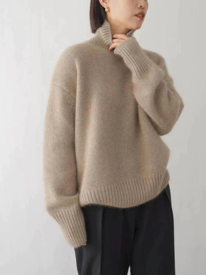 Beige turtleneck knit sweater with ribbed collar and cuffs