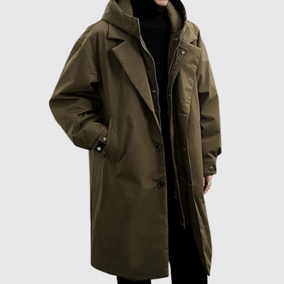 Men's green lightweight rain jacket with hood, front buttons, long length.