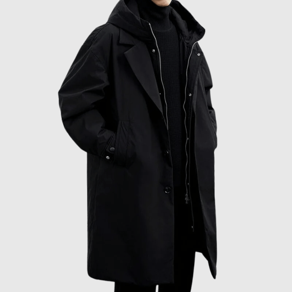 Men's black lightweight rain jacket with hood and front snap buttons, long length.