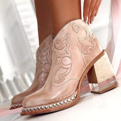 Women's western ankle boots in light blush pink with decorative stitching and studded trim