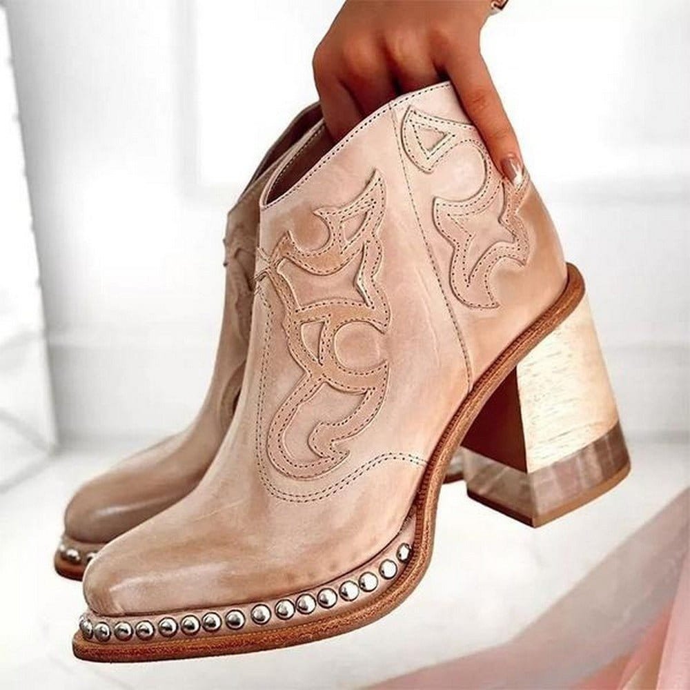 Women's western ankle boots in blush pink with decorative stitching and studded leather sole edge