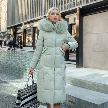 Women's long down coat in mint with large faux fur collar and button placket