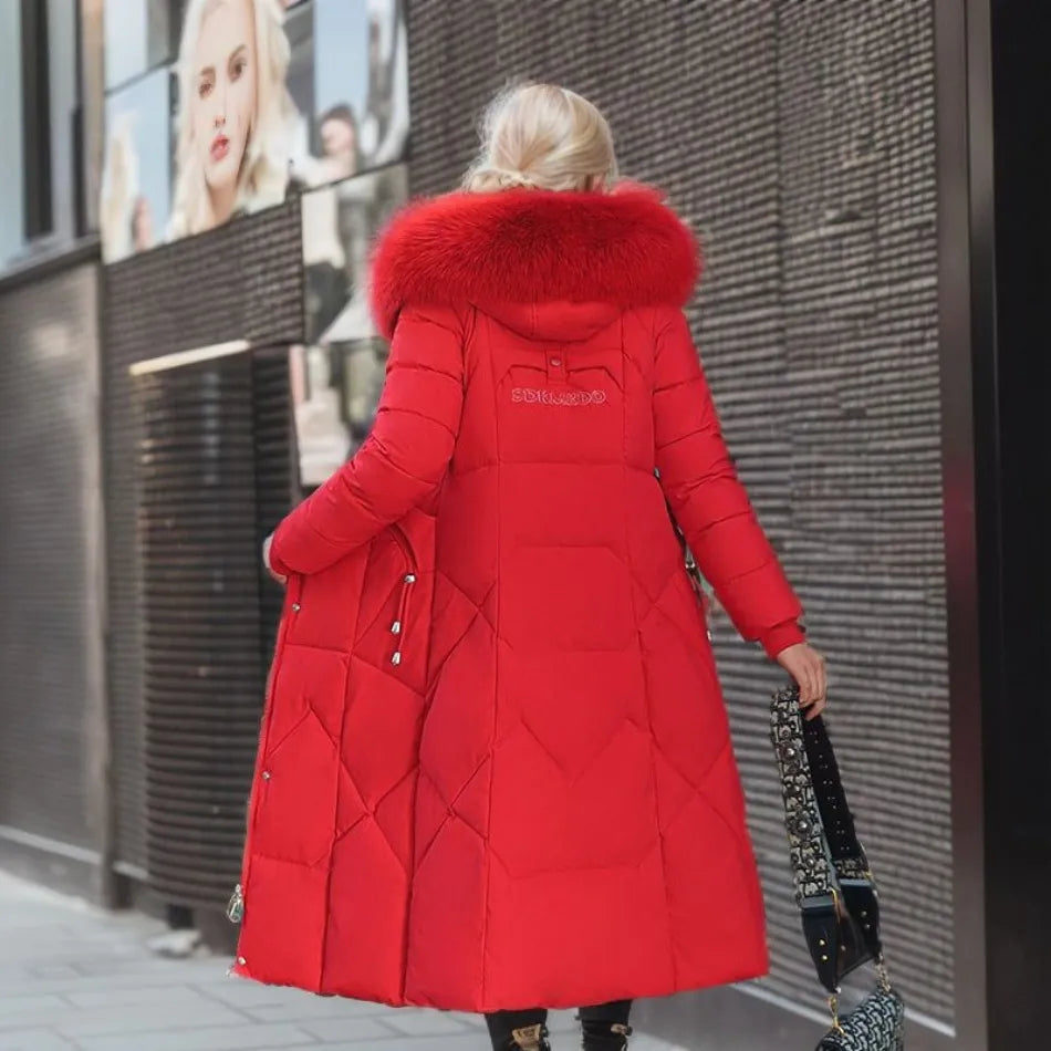 Red long down coat with quilted panels and plush fur-trimmed hood