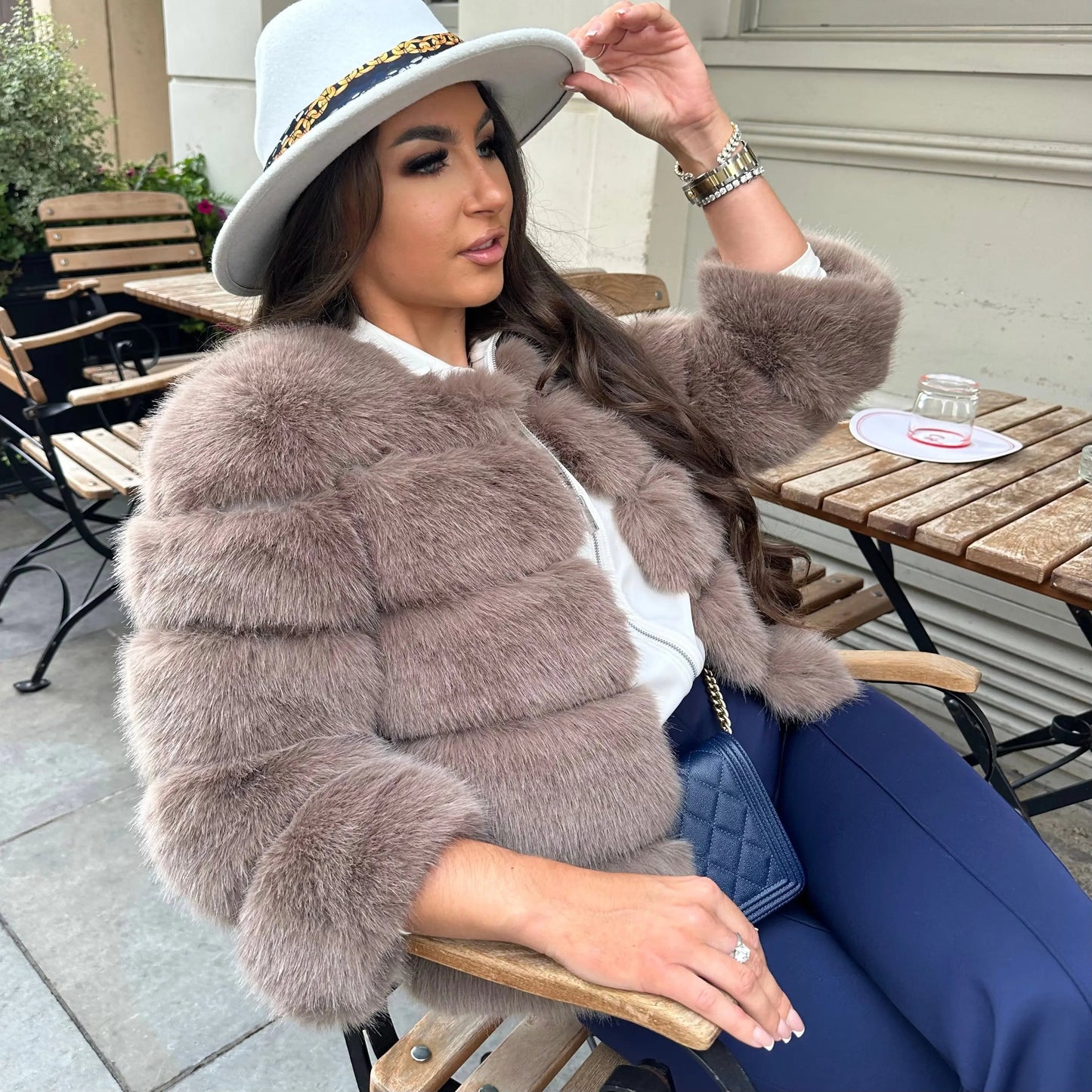 Women's taupe faux fur cropped jacket with tiered puff panels and stand collar