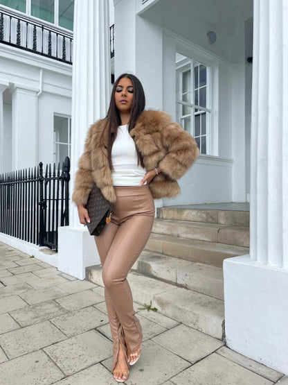 Women's brown faux fur jacket with thick collar and padded puff sleeves