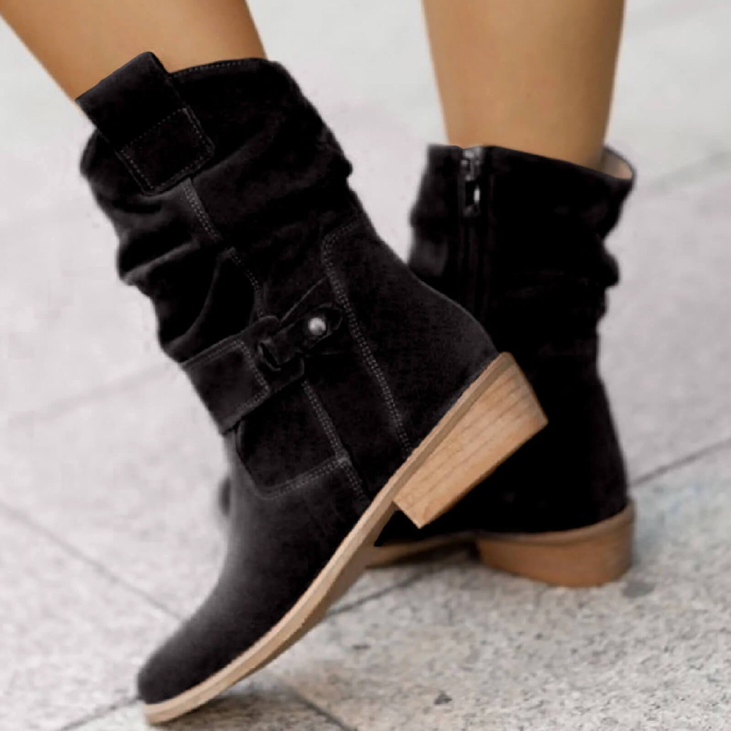 Black suede slouch boots with buckle straps and side zipper detail