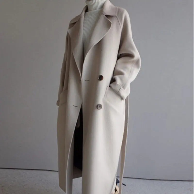 Beige long wool coat with notched lapels, double-breasted buttons, and side pockets