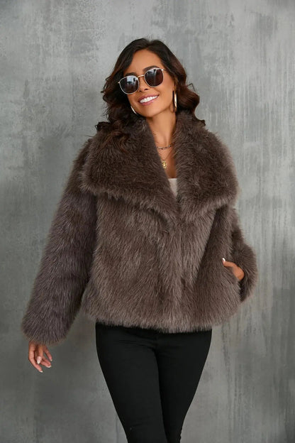 Brown faux fur jacket with open front and plush textured finish