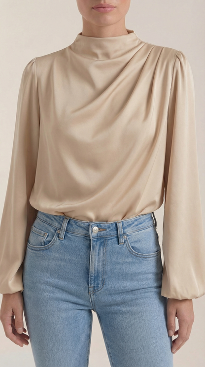 Draped long sleeve blouse in champagne satin with high cowl neck and soft gathers