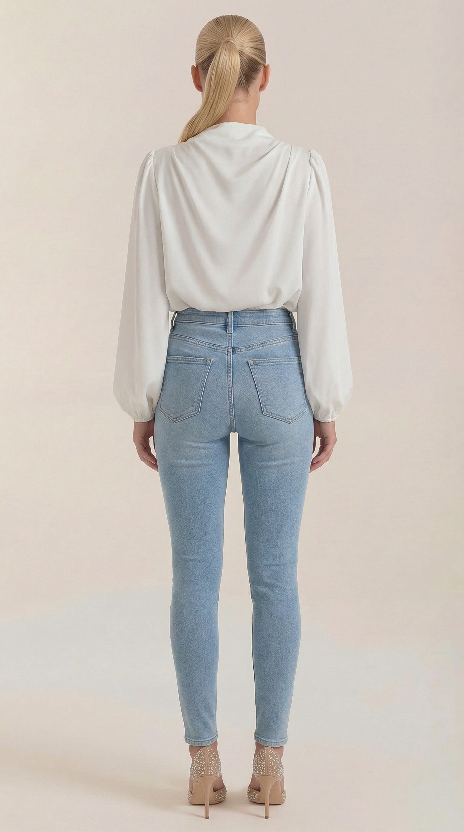 White draped long-sleeve blouse, back view, with gathered shoulders
