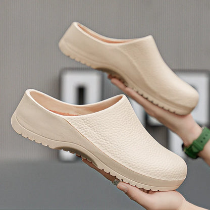 Beige textured slip-on clogs with open back and ridged sole for non-slip traction