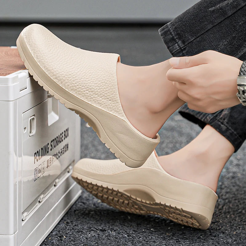 Beige textured slip-on clogs with open back and grippy tread sole