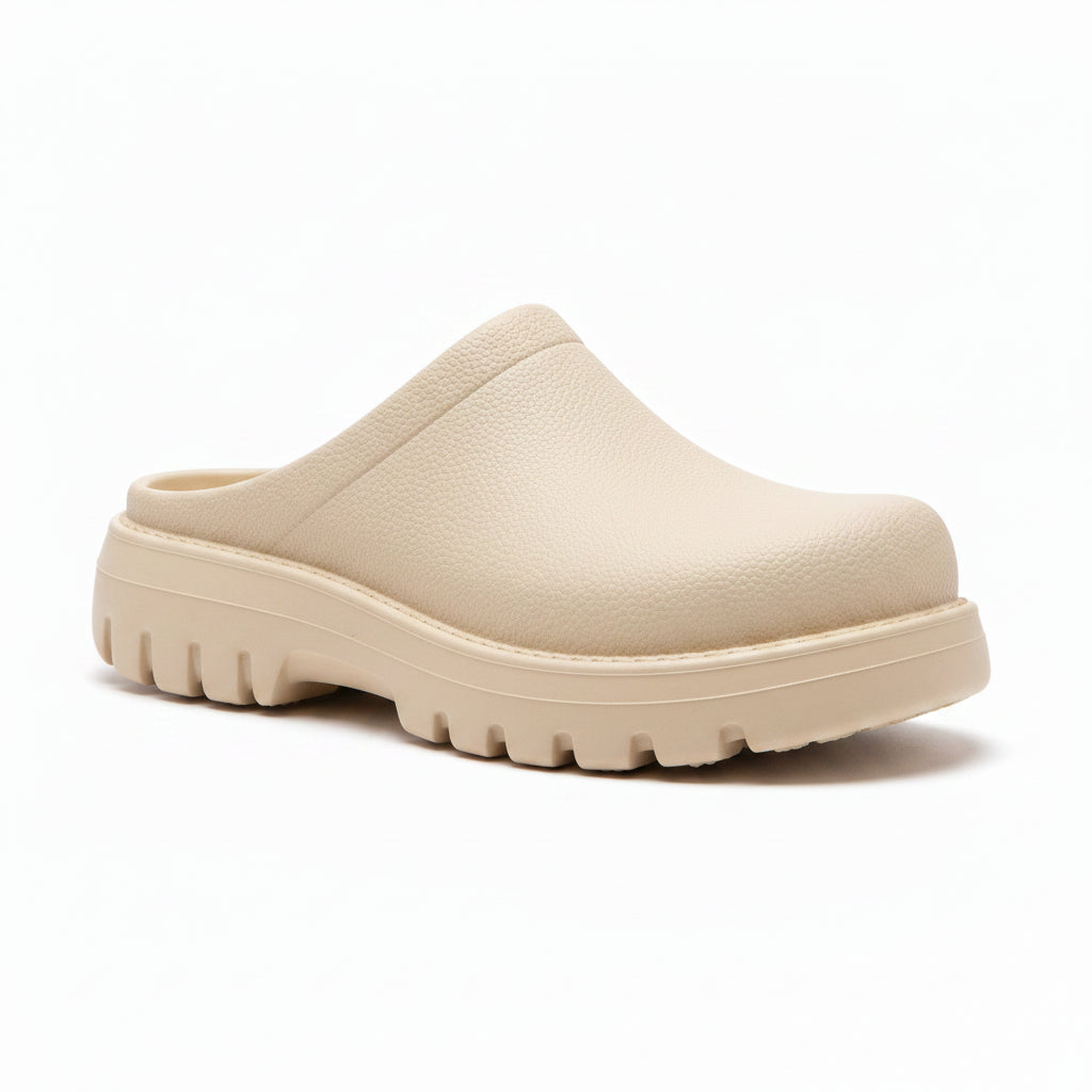 Light beige slip-on clog with textured upper, open back, and rugged tread sole