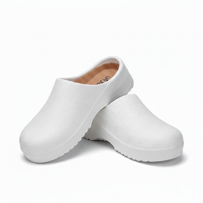 White textured slip-on clogs with open back and thick ridged non-slip outsole