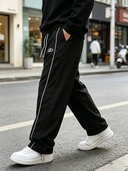 Men's quick-dry joggers, black with white side stripe and ankle cinch draw cords