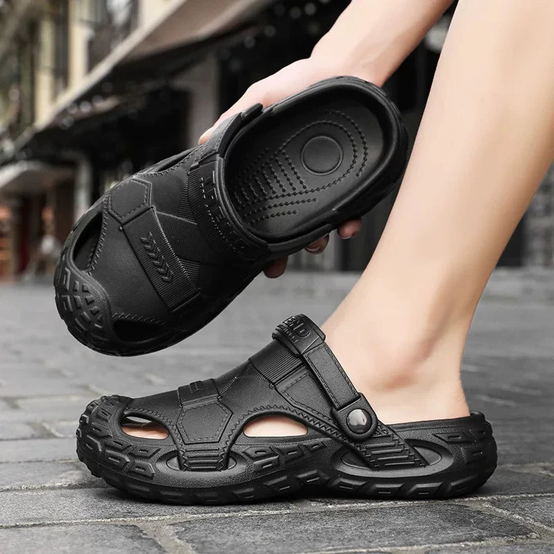 Men's summer clog sandals in black on feet with adjustable strap and cushioned top