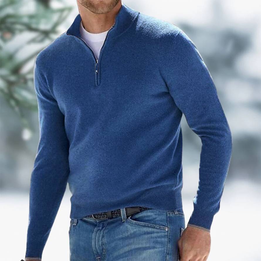 Blue half-zip pullover sweater with short collar and zipper at chest.