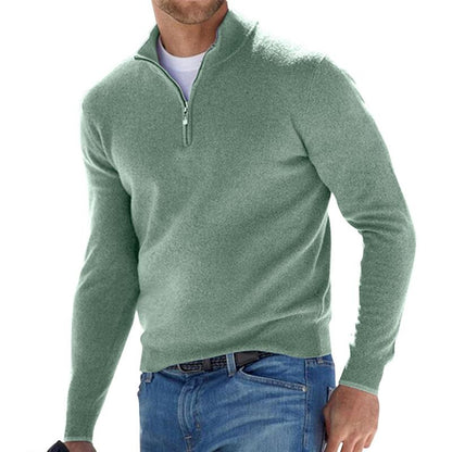 Green half-zip pullover sweater with a short collar and center zipper.