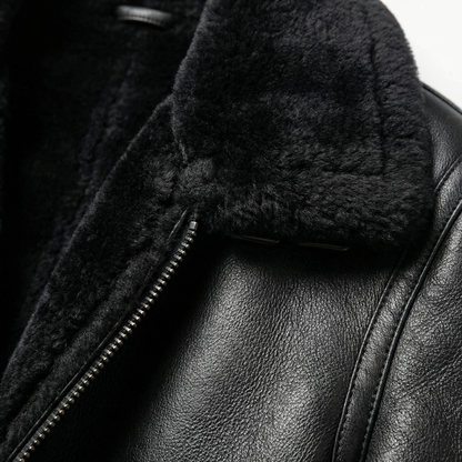 Black leather aviator jacket detail with shearling lining and metal zipper
