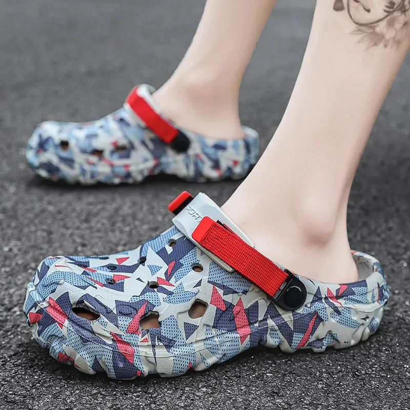 Camouflage clog slipper with red strap worn on foot for outdoor use