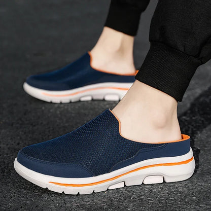 Backless navy slippers with orange collar and thick white sole