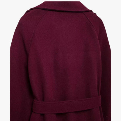 Burgundy trench coat back view with wide belt and structured yoke