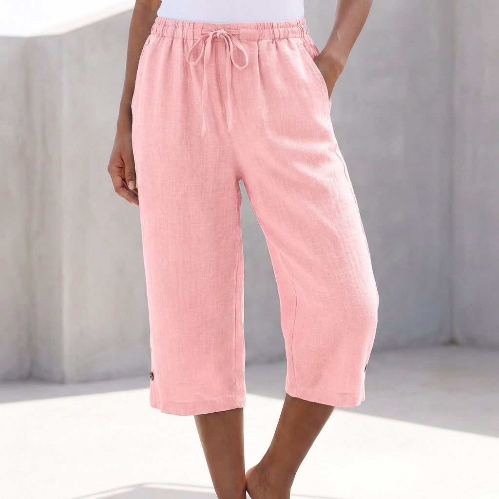 Pink relaxed-fit capri pants with drawstring waist, calf-length wide legs