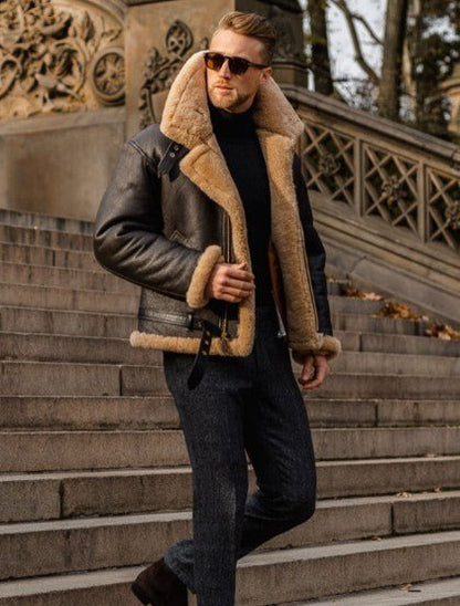 Men's aviator leather jacket with tan shearling lining and collar, front zip, side stance
