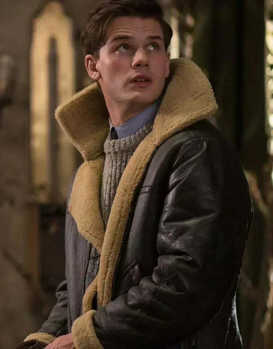 Men's aviator leather jacket with tan shearling collar and lining, dark sleeves, side view