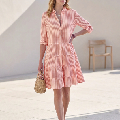 Pink striped tiered shirtdress with button front and three-quarter sleeves