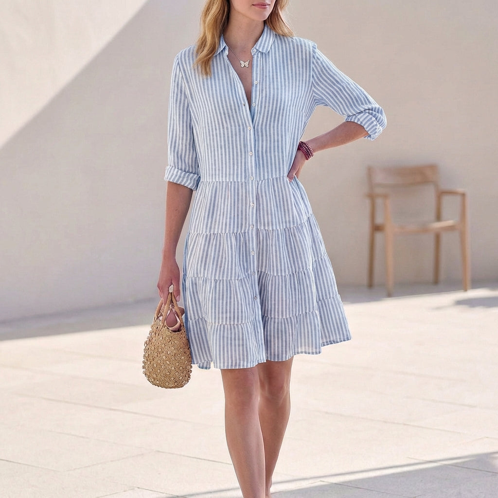 Blue striped tiered shirtdress with button front and three-quarter sleeves
