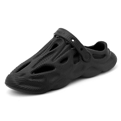Black hollow garden clogs with textured surface and oval cutouts