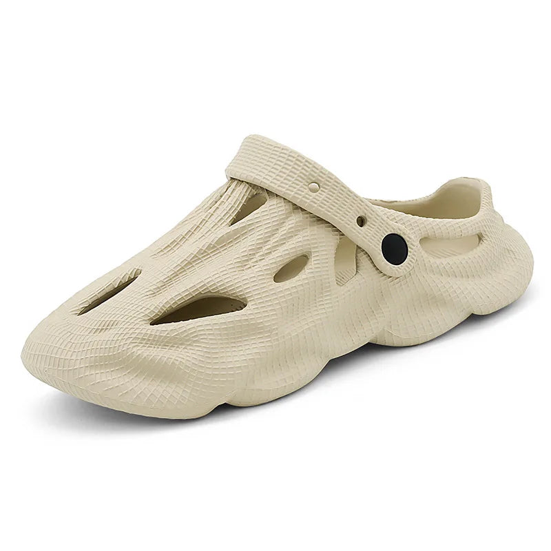 Cream hollow garden clogs with oval cutouts and adjustable strap