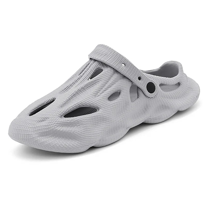 Light gray hollow garden clogs with oval cutouts and strap detail