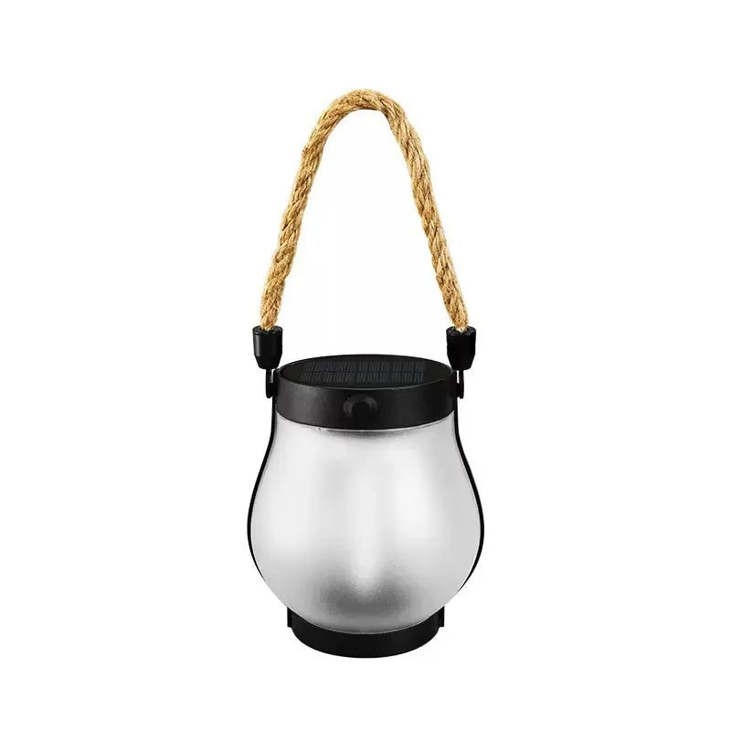 Hanging solar flame lantern with rope handle and black cap, silver glass-like body