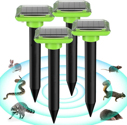 Solar ultrasonic repellent spike set with four black spikes and green solar tops