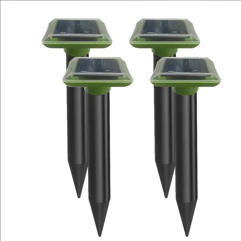 Solar ultrasonic mole repellent spike set with two black stakes and green solar tops