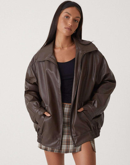 Brown oversized PU leather jacket with zip front, stand collar, and elastic cuffs.