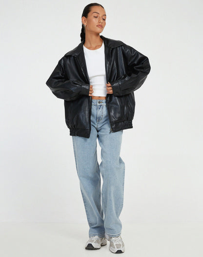 Black oversized PU leather jacket with zip front, stand collar, and elastic cuffs.