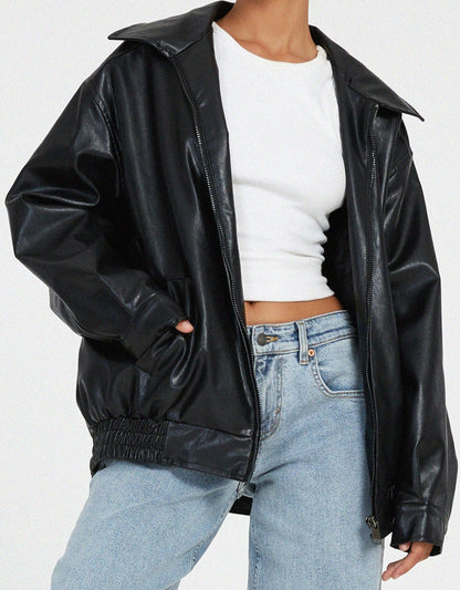 Black oversized PU leather jacket detail with zip front and elastic cuff at sleeve hem.