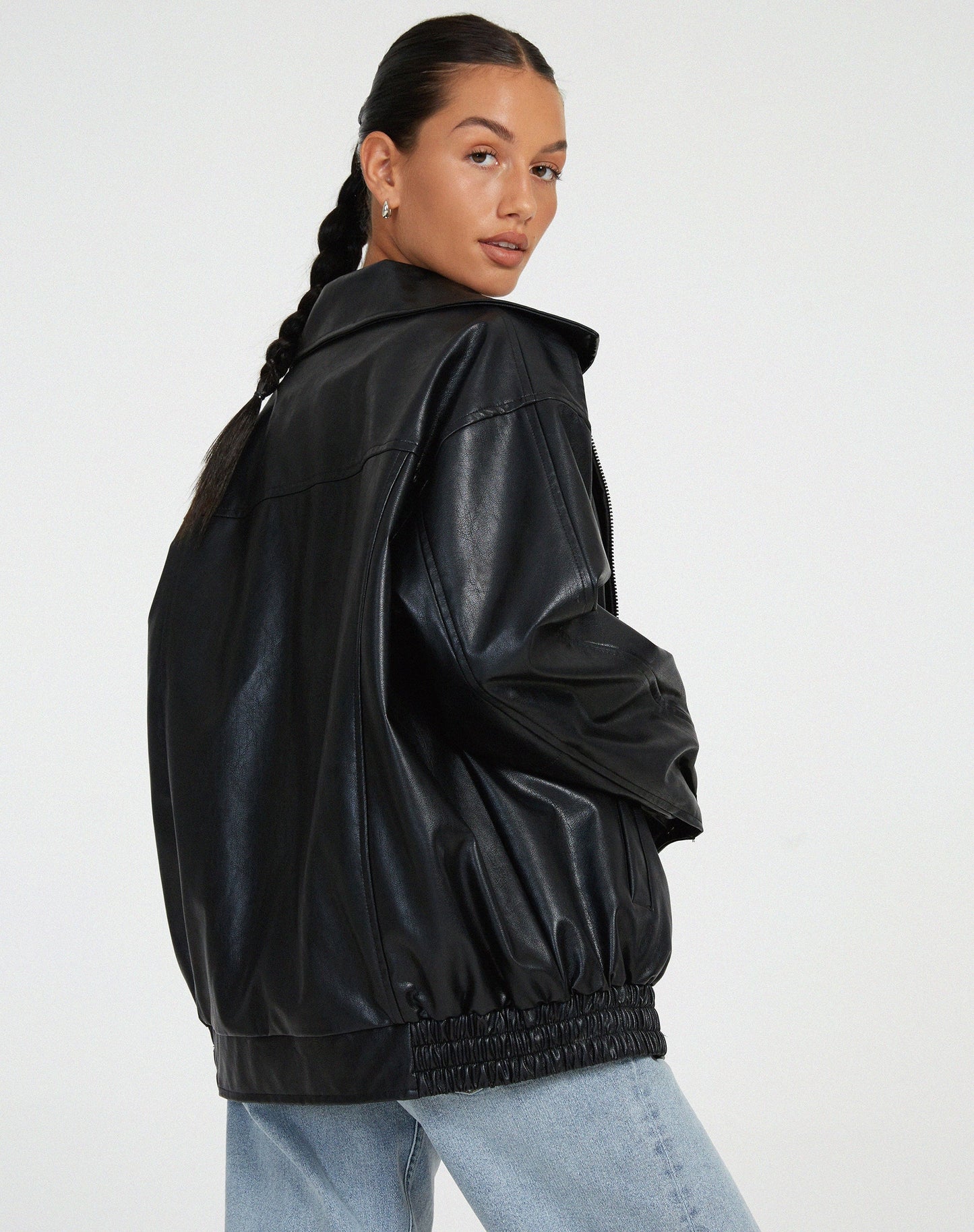 Black oversized PU leather bomber jacket with zip front and gathered elastic cuffs and hem.