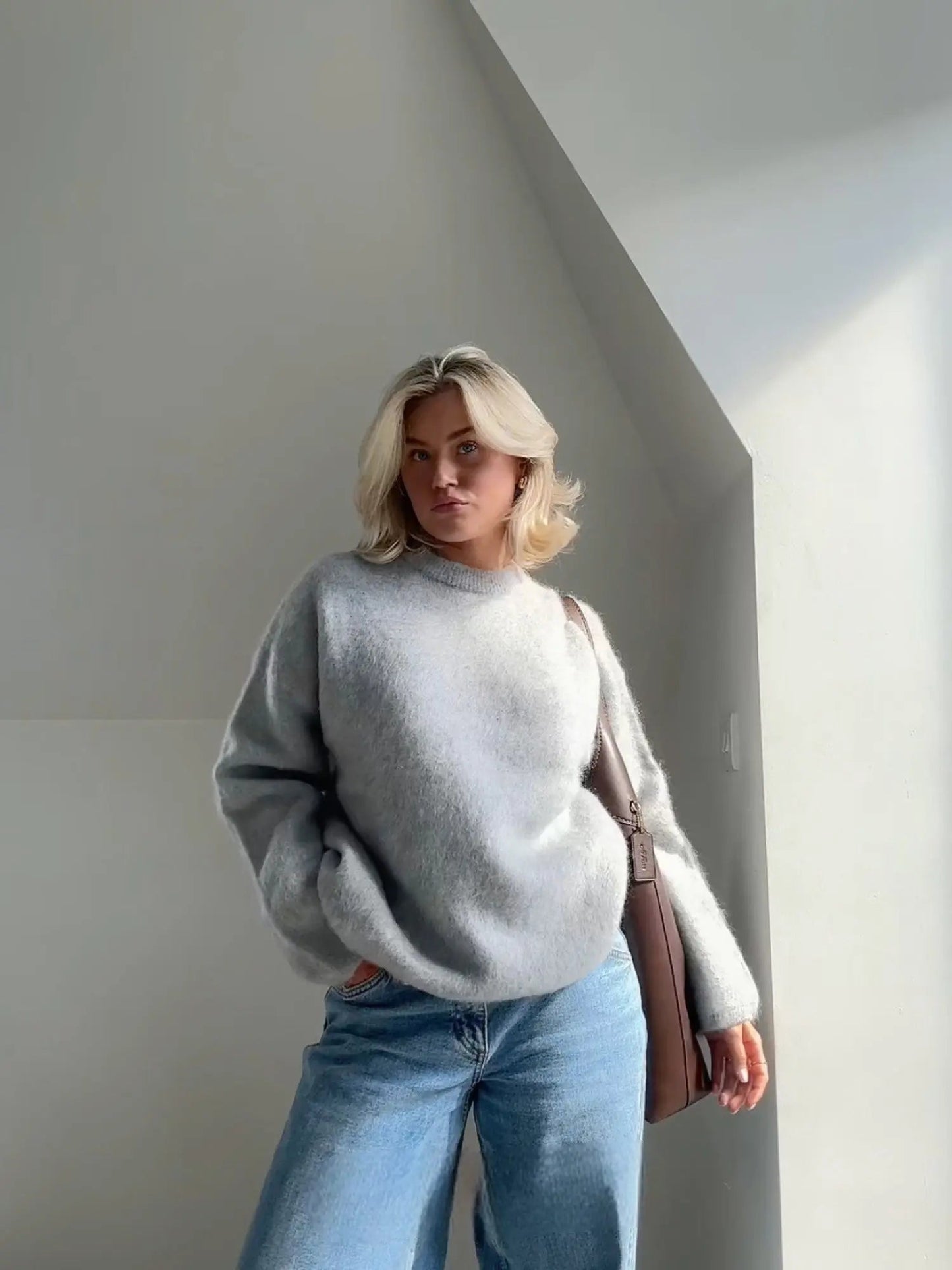 Grey mohair sweater with crew neck and relaxed long sleeves