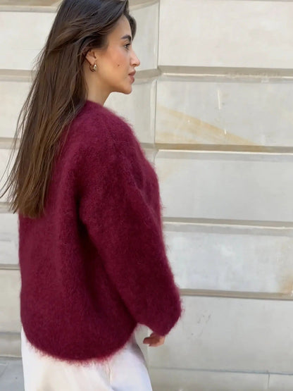 Burgundy mohair sweater in side profile, crew neck and long sleeves