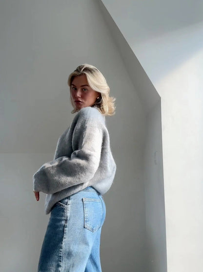 Grey mohair sweater in side profile, crew neck and long sleeves