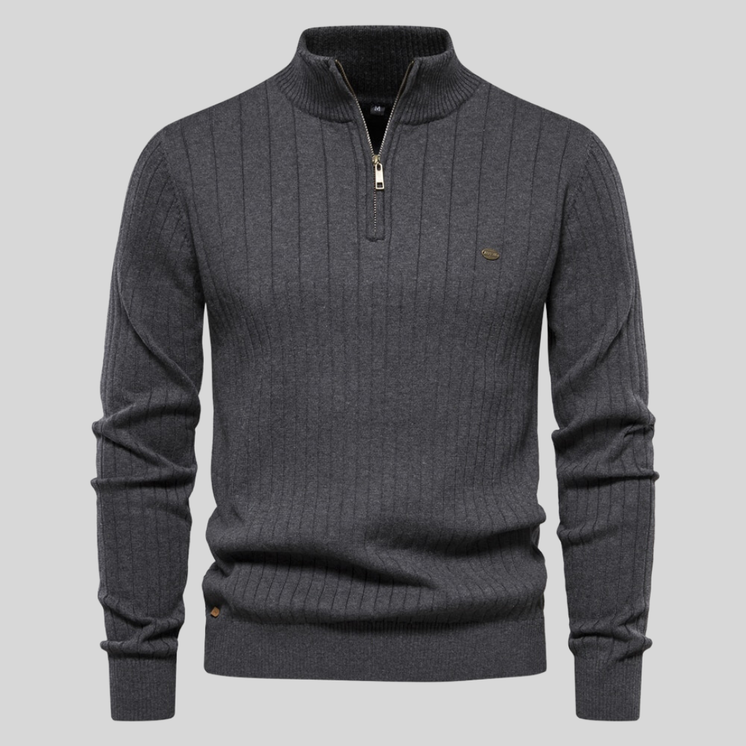 Ribbed half-zip knit sweater in dark grey, long sleeves, stand collar, small chest logo.